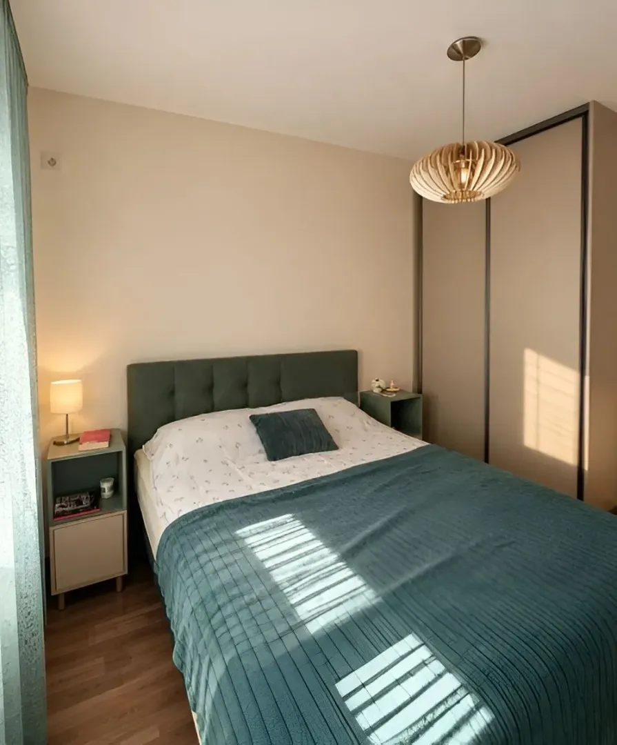 Furnished bedroom with a double bed, wardrobe, and nightstands.