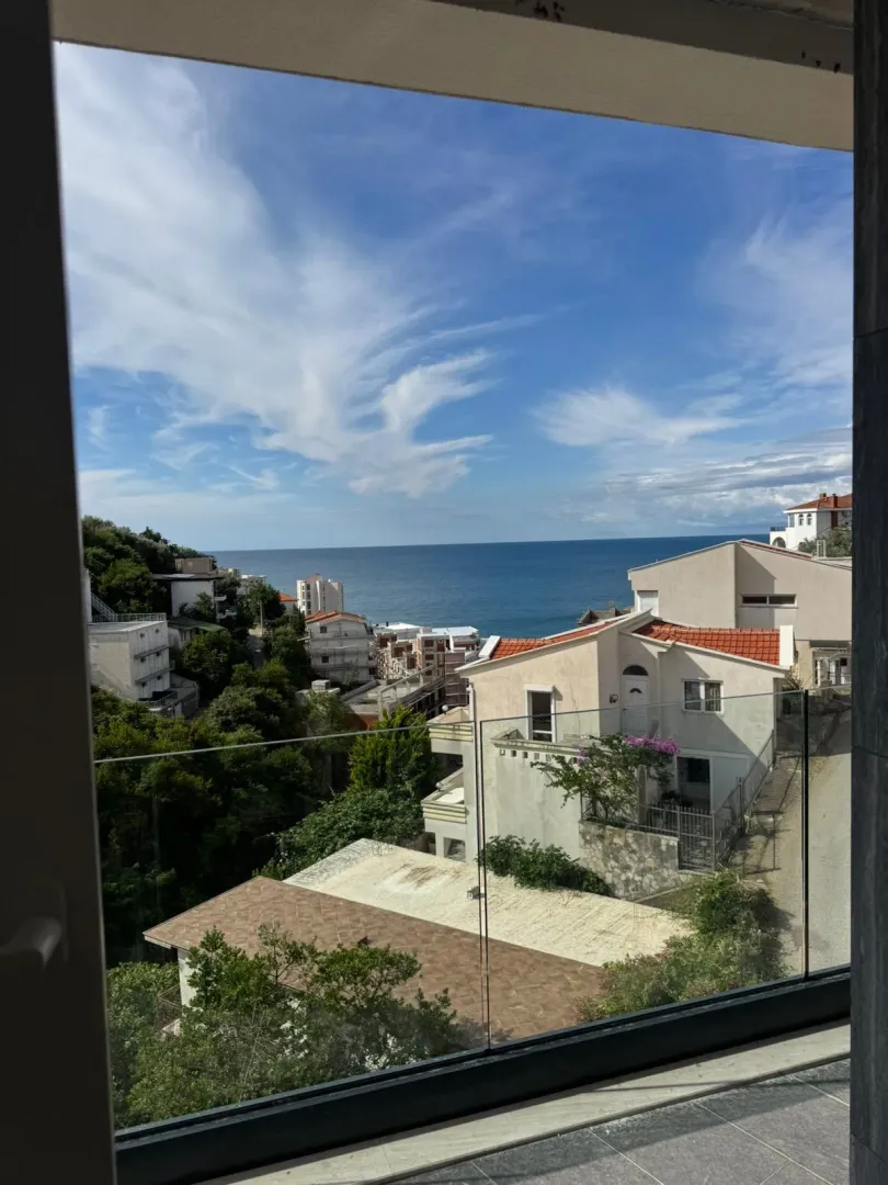 View of the sea and surrounding houses from the property terrace.