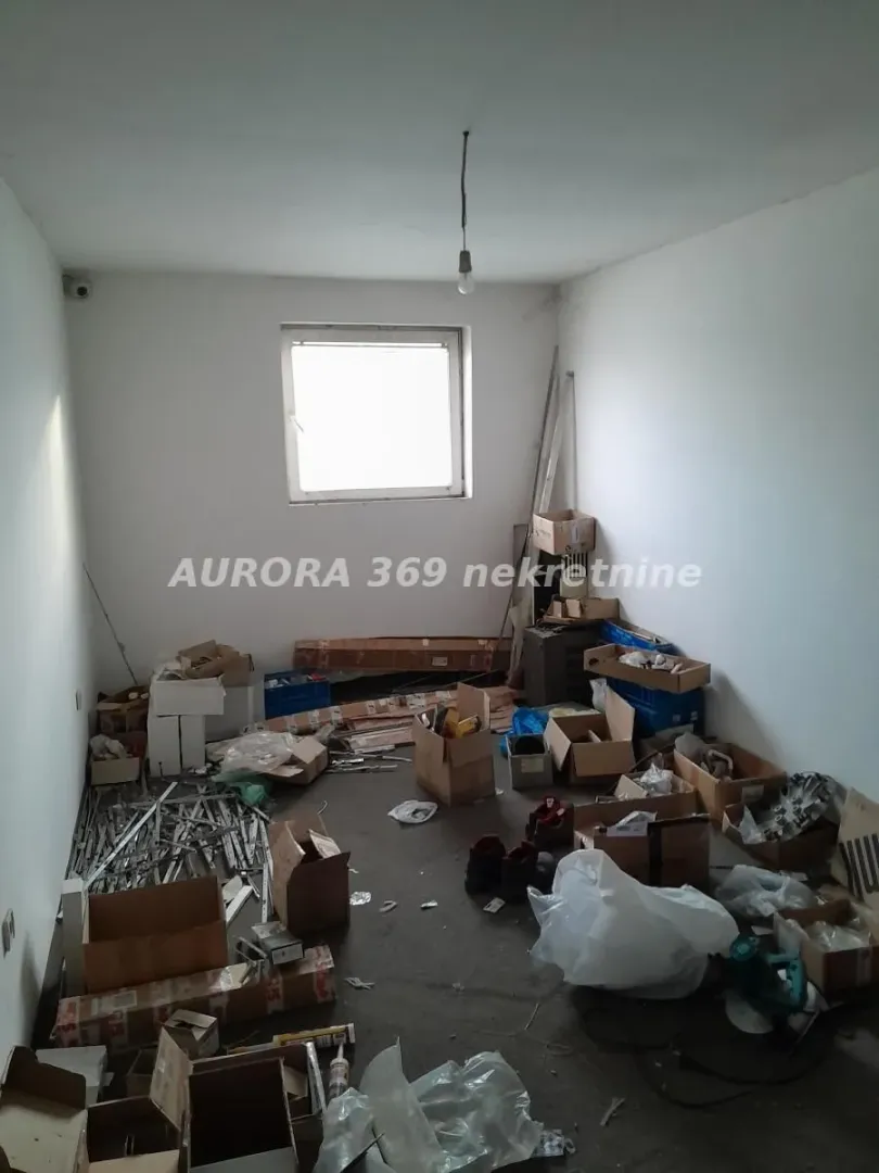 Empty room filled with boxes and construction materials.