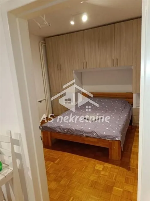Bedroom with a double bed and built-in wardrobes.