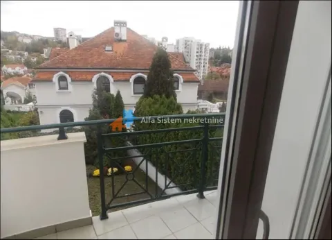 View from the balcony towards surrounding buildings and yard. - image 9