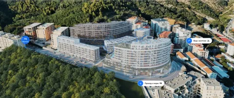 Pogled iz vazduha na kompleks zgrada okružen zelenilom. - image 2