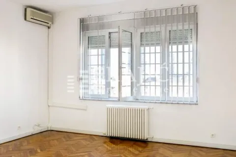 Empty room with windows, radiator, and air conditioning unit. - image 6