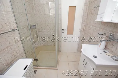 Small bathroom with a shower cabin and a sink. - image 16