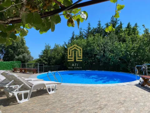 Yard with a swimming pool and sun loungers. - image 16