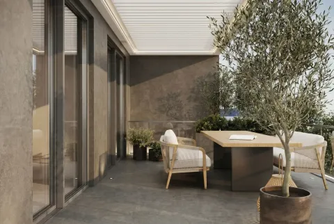 Spacious covered terrace with seating furniture and potted trees. - image 12