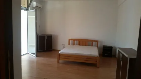 Bright bedroom with a wooden bed. - image 11