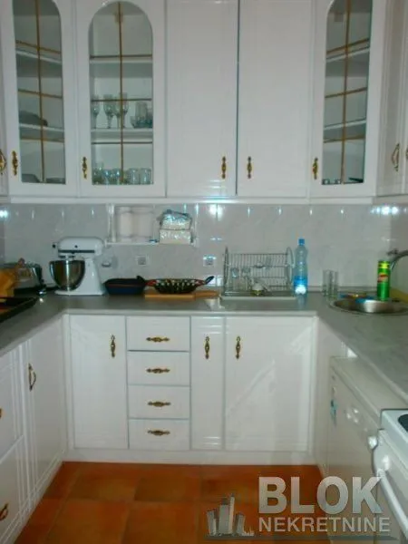 White kitchen with traditional cabinets and countertops.