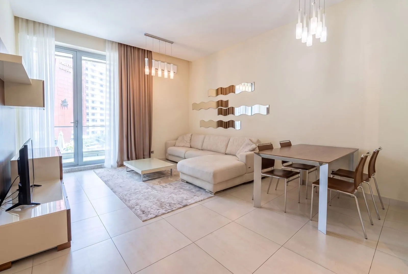 Spacious living room with seating area and dining space.