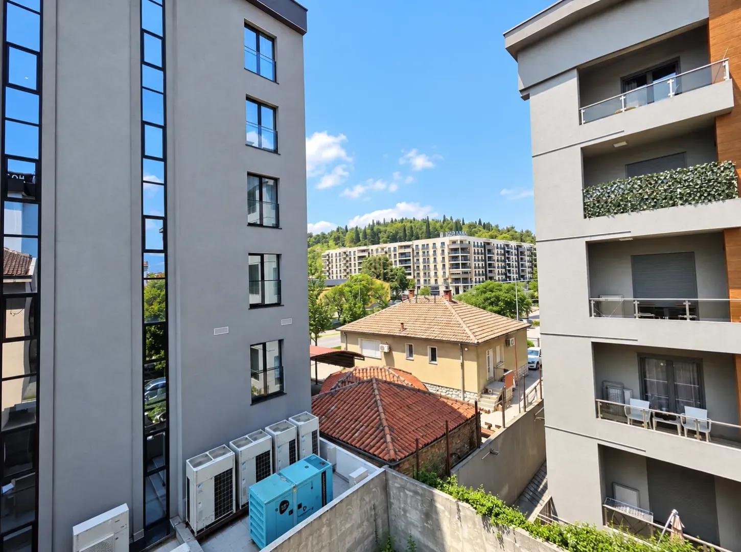 View of the surrounding buildings and landscape from the building's perspective.