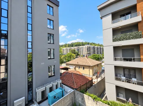 View of the surrounding buildings and landscape from the building's perspective. - image 5