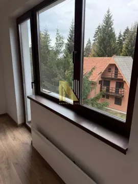 View through the window of the surrounding nature and houses. - image 4