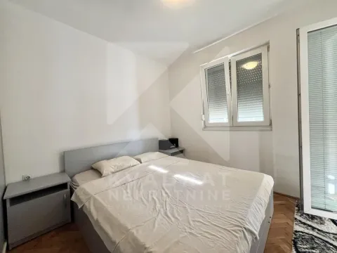 Bedroom with a double bed, bedside tables, and a window. - image 5