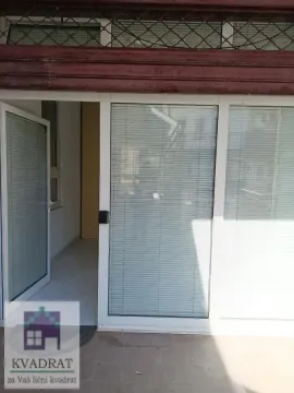 Entrance to a commercial space with glass doors and windows. - image 8