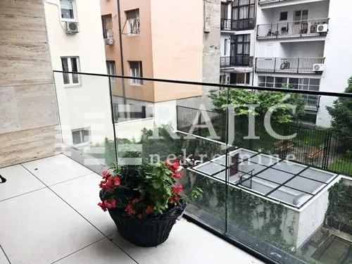 View from the balcony overlooking surrounding buildings and courtyard.