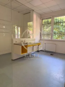 Small kitchen with a sink in an empty room with windows. - image 12