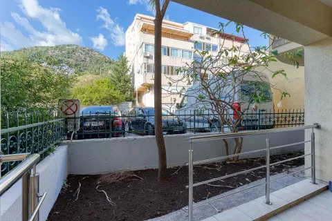 View from the terrace towards the courtyard and surrounding buildings with a hill in the background. - image 26