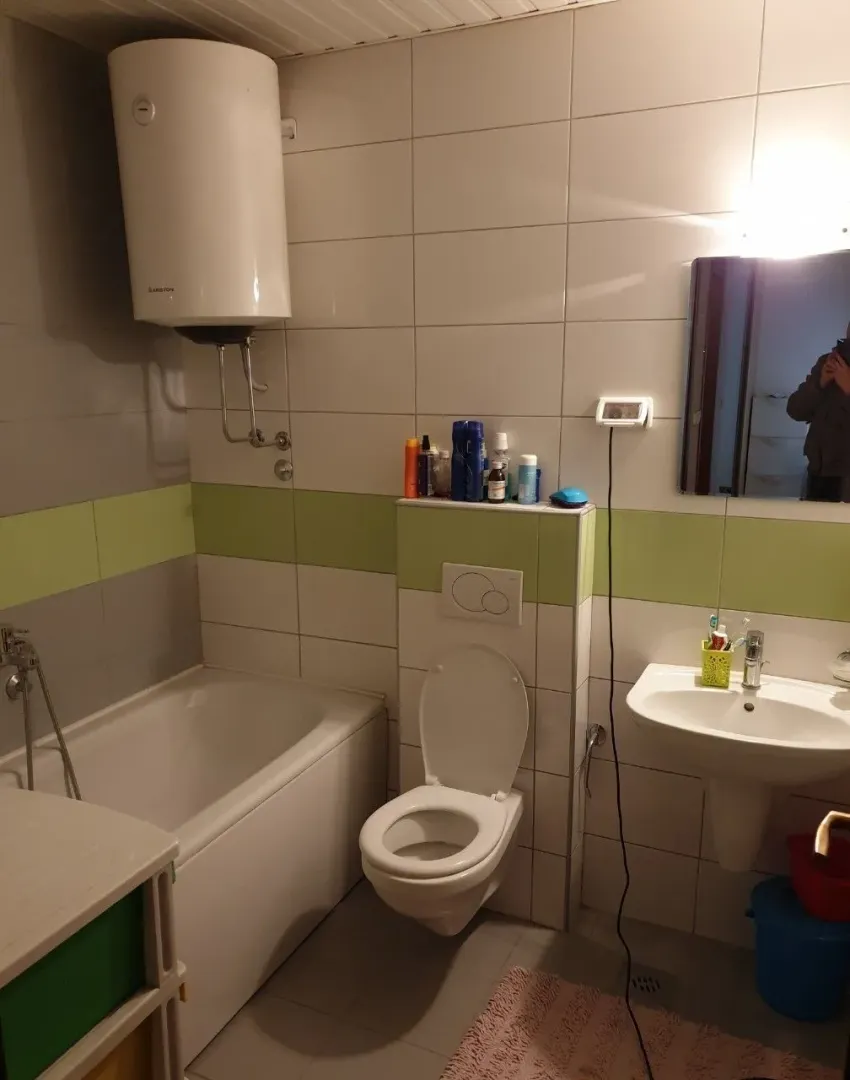 Bathroom with a bathtub and boiler.