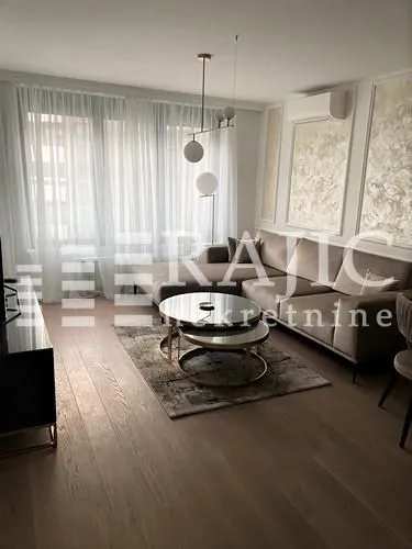 Modern living room with a sectional sofa and a coffee table.