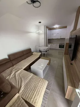 Living room connected to the dining area and kitchen. - image 2