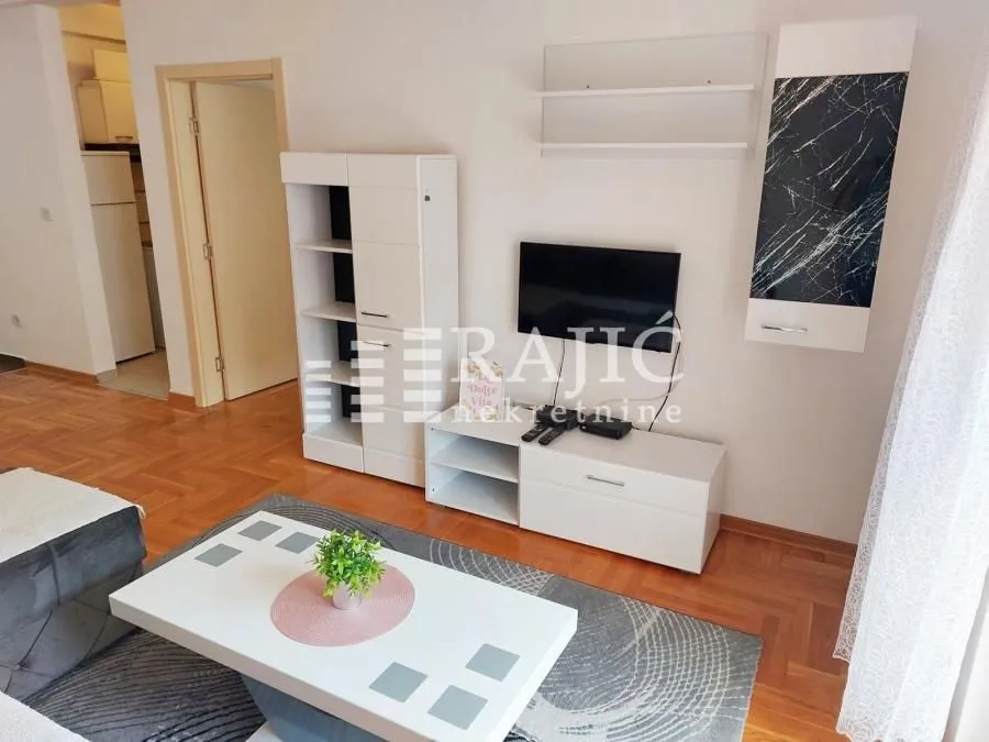 Living room with furniture and television.