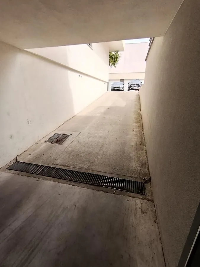 Access ramp leading to the underground parking garage.