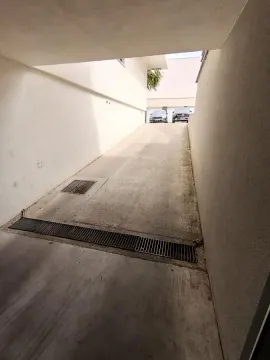 Access ramp leading to the underground parking garage. - image 9