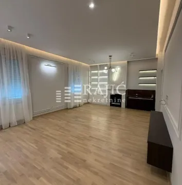 Spacious bright living room with parquet flooring and recessed ceiling lighting. - image 6