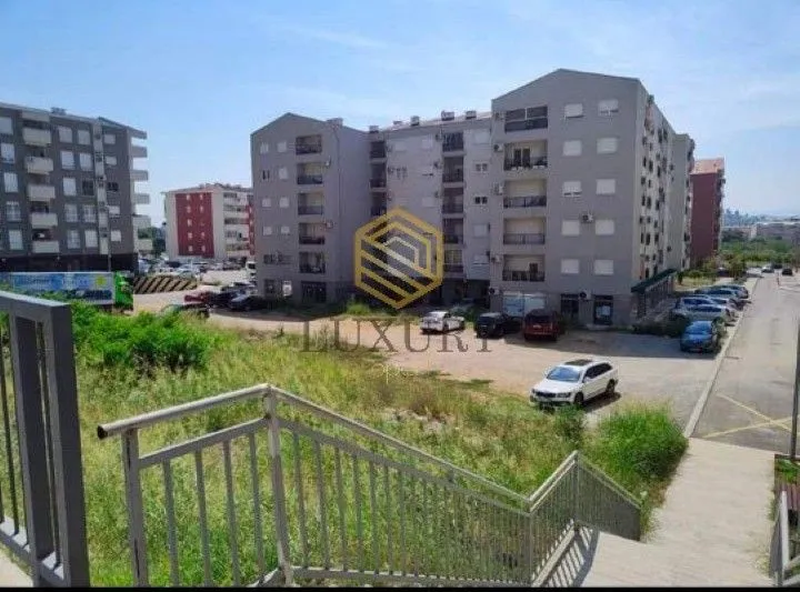 View of the residential building and surrounding courtyard from the stairs.