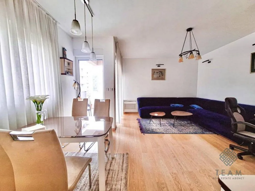 Spacious living room with a dining area and seating set.