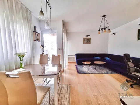 Spacious living room with a dining area and seating set. - image 4