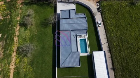 Aerial view of the house with a swimming pool and yard. - image 3