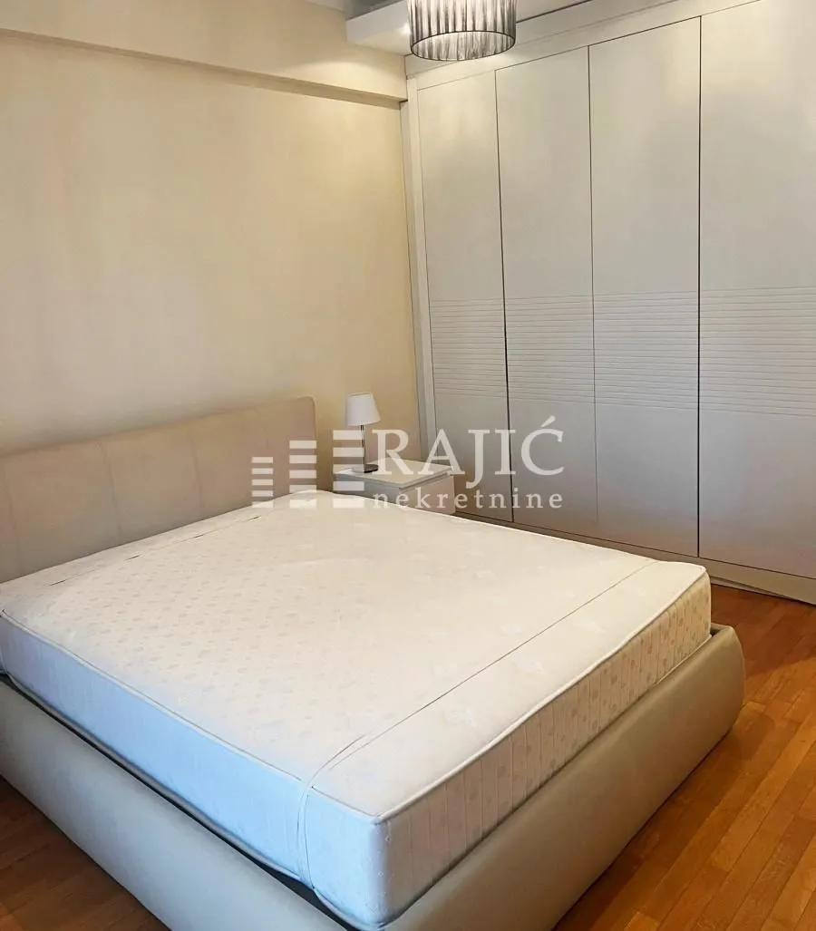 Bedroom with a double bed and a built-in wardrobe.