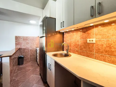 Kitchen equipped with white cabinets, refrigerator, and ceramic tiles. - image 4
