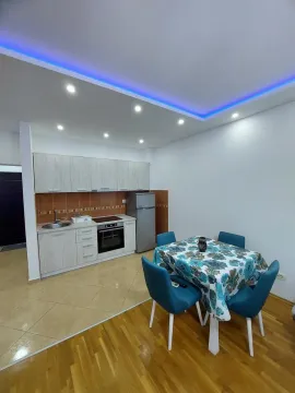 Kitchen with dining area and modern ceiling lighting. - image 4