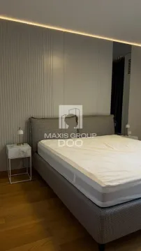 Modern bedroom with a double bed and nightstands. - image 7