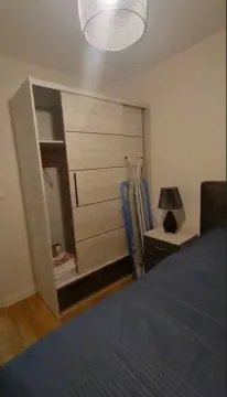 Furnished bedroom with a wardrobe and a double bed. - image 5