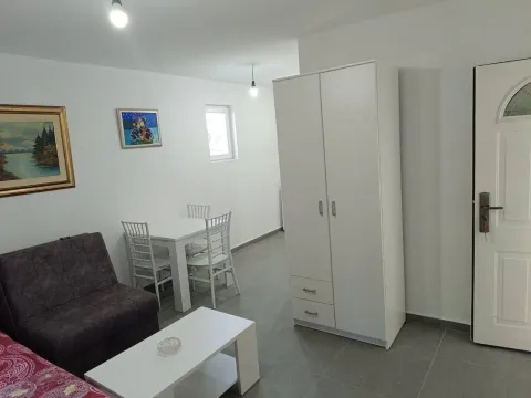 Living room with sofa, dining table and wardrobe. - image 3