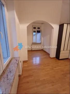Empty room with wooden flooring, a window, and a wardrobe. - image 12