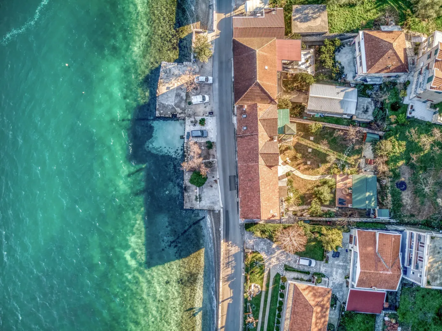Aerial view of properties along the coastline.