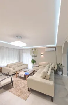 Spacious living room with a seating set and a wooden coffee table. - image 6