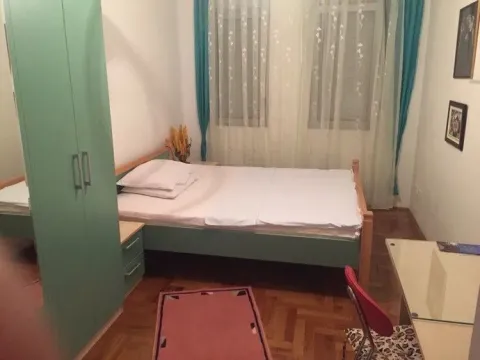 Bright bedroom with green furniture. - image 7