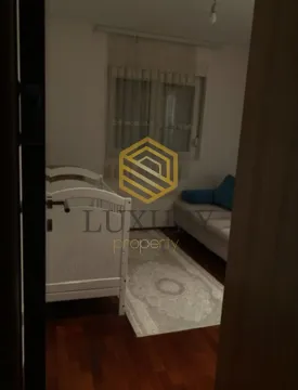 Children's bedroom with a crib and a sofa. - image 3
