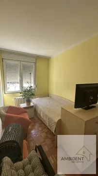 Smaller bedroom with a bed, dresser, and a window. - image 17