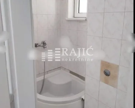 Smaller bathroom with a shower cabin tiled with ceramic tiles. - image 8
