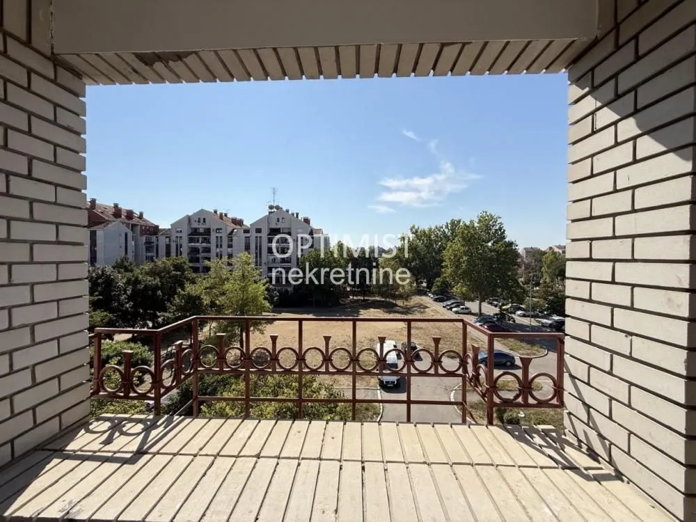 View from the balcony overlooking the neighborhood and greenery.