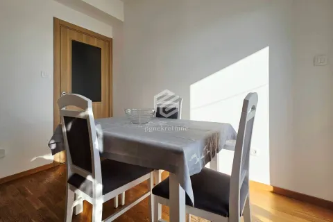 Dining table with chairs in a bright room. - image 18