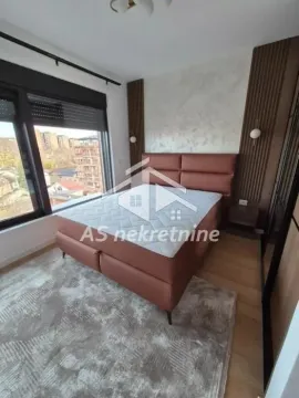 Modern bedroom with a double bed and a large window. - image 19