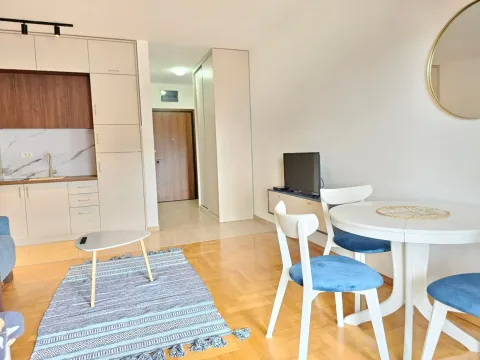 Living room with dining area and part of the kitchen. - image 15