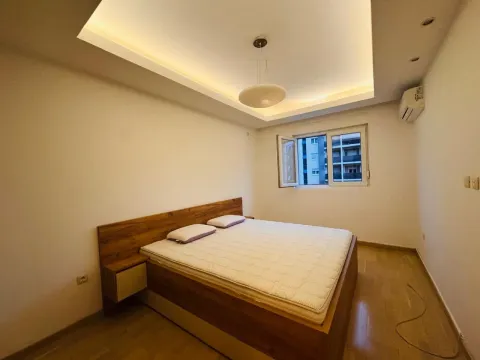 Bedroom with a double bed and a drop ceiling with lighting. - image 13